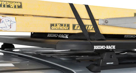 Yellow kayak on Rhino-Rack Pioneer wrap pads with straps