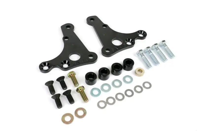 Black metal Ridetech SLA mounting brackets with hardware for SN95 caliper brackets on Mustang
