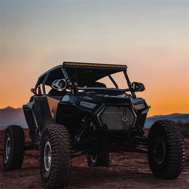 Black off-road vehicle with Rigid 430613 Revolve 30 Bar Wht Backlight for better visibility