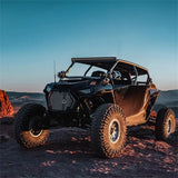 Black off-road vehicle with Rigid 430613 Revolve 30 Inch Bar Wht Backlight in action