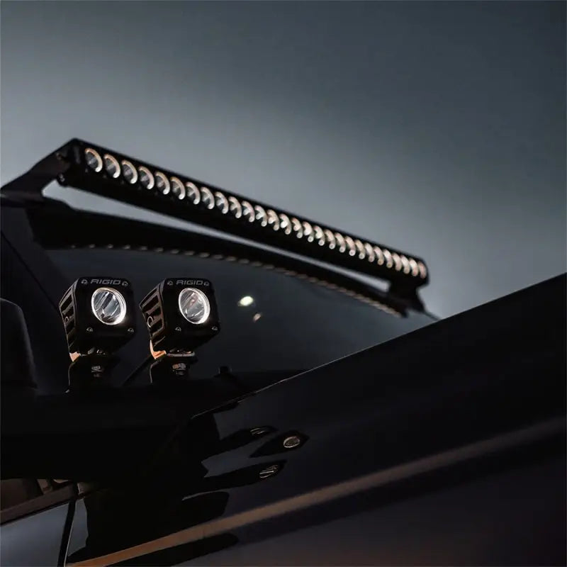 Illuminated off-road vehicle lights on Rigid 430613 Revolve 30’’ Bar Wht Backlight