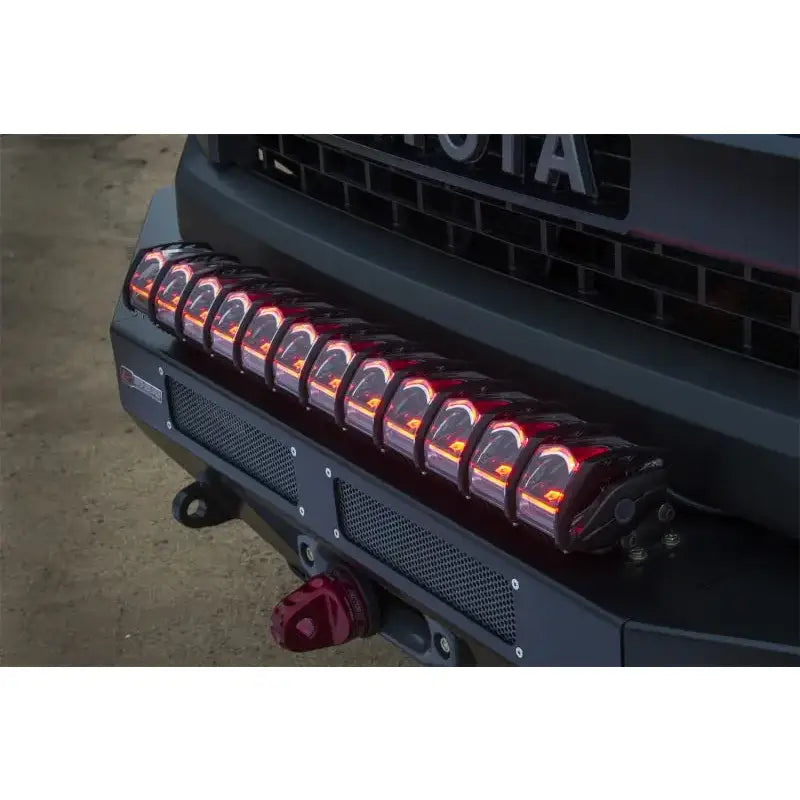 Rigid Industries 30in Adapt Light Bar installed on a vehicle, showcasing its advanced Active View Technology and customizable accent lighting.