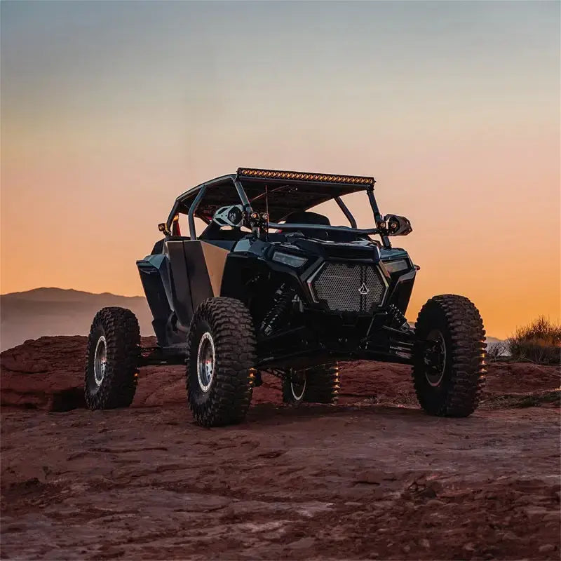 Black off-road vehicle with Rigid Industries Revolve 10in Bar white trim ring