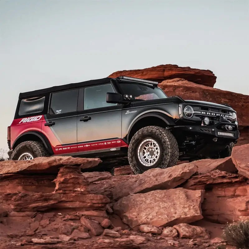 Black and red off-road Ford Bronco with Rigid Industries Revolve 10in Bar with white trim