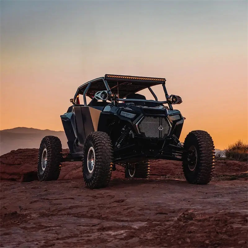 Black off-road vehicle with Rigid Industries Revolve 20in Bar and white trim ring