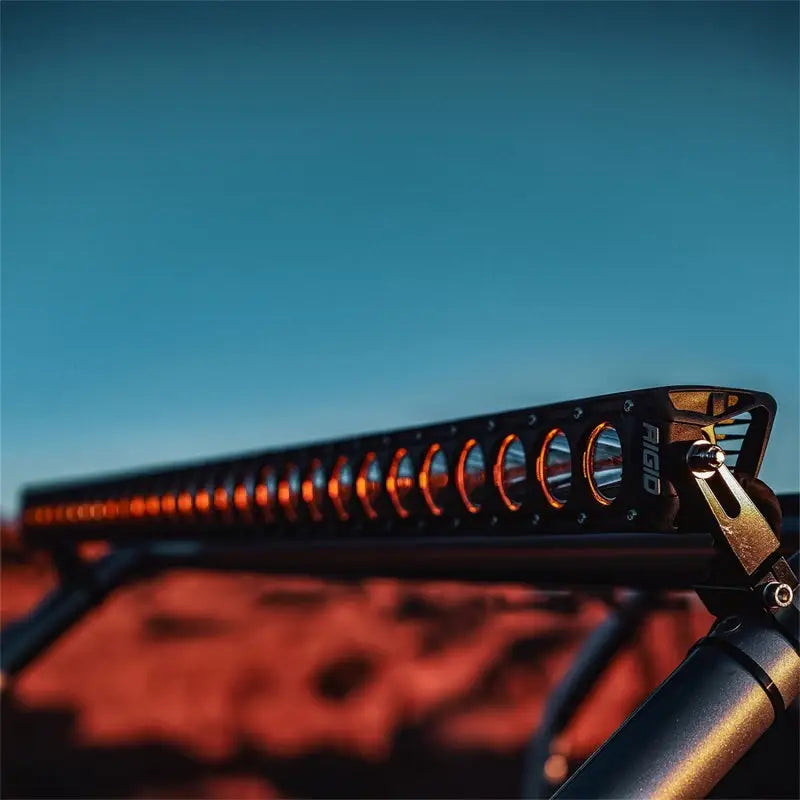 Illuminated off-road LED light bar on Rigid Industries Revolve 50in bar with white trim