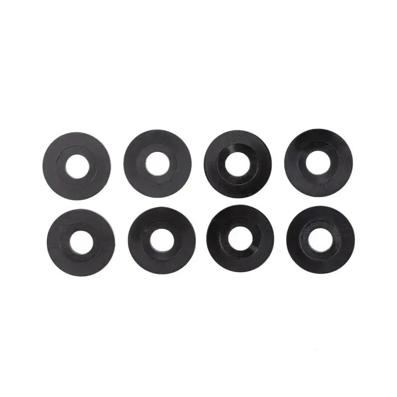 Eight black circular washers for RLIK27 Trailfx Tailgate Hardware for Ford F150, enhancing secure and reliable tailgate operation.