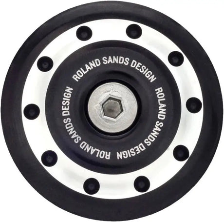 Black and silver motorcycle part for BMW rear drive by Roland Sands Design