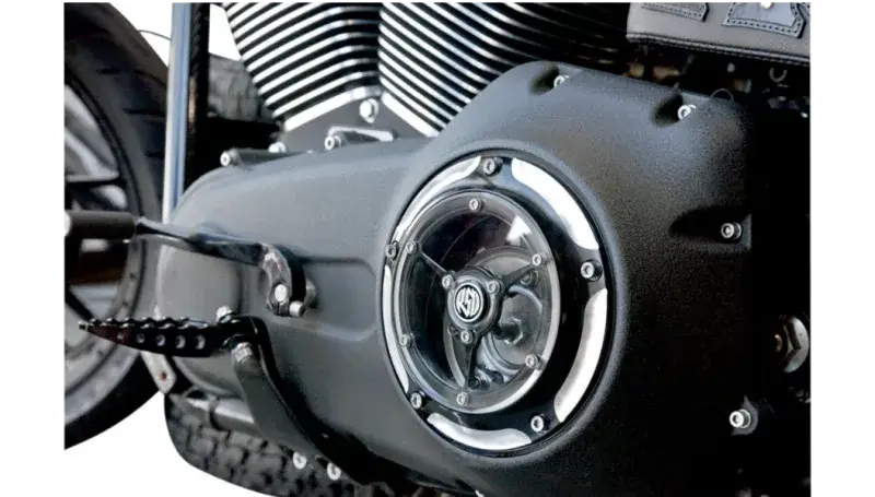 Black motorcycle engine with clear cover.