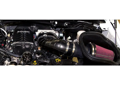 Roush supercharged engine with aftermarket air intake on Ford F-150 supercharger kit