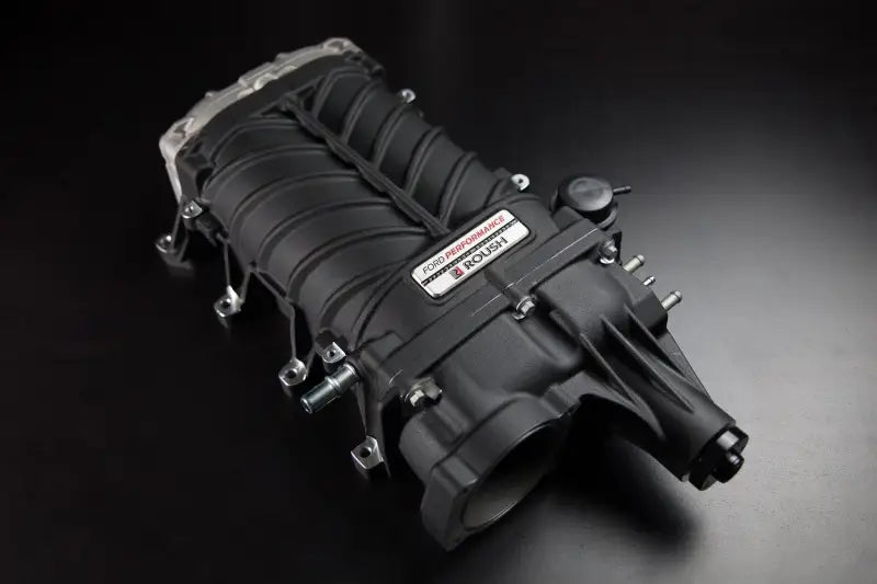 Black Roush supercharger kit with metal accents on Ford Mustang 2022 GT V8