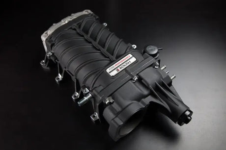 Black Roush supercharger kit with metal accents on Ford Mustang 2022 GT V8