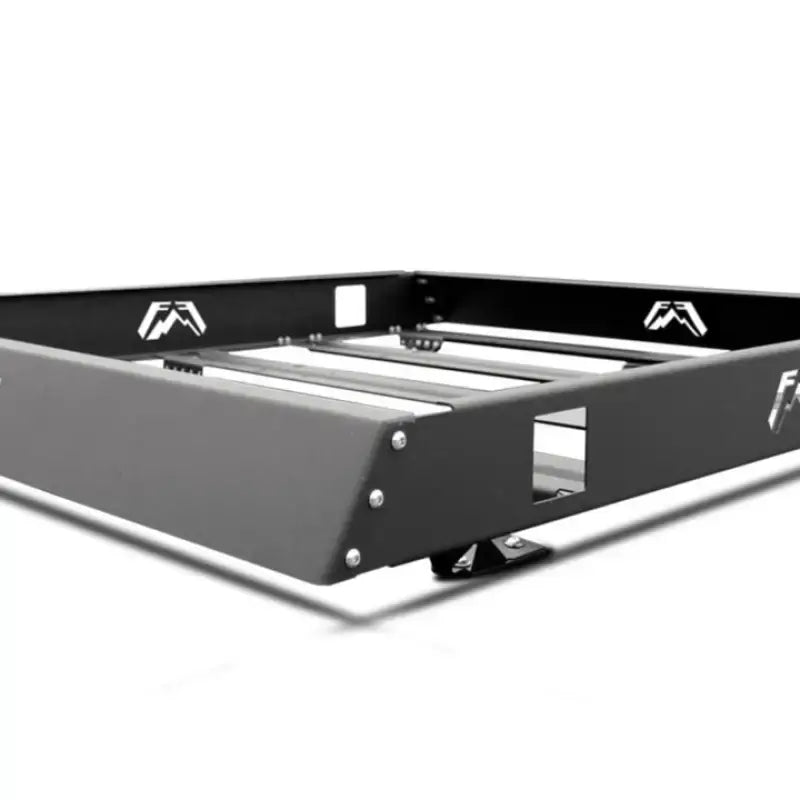 Black metal roof rack with bent flange, crossbars, and storage tray for Fab Fours Bent