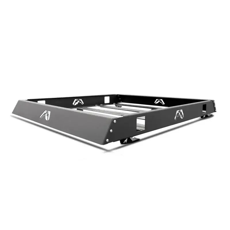Black and silver Fab Fours Bent Flange roof rack with integrated storage tray