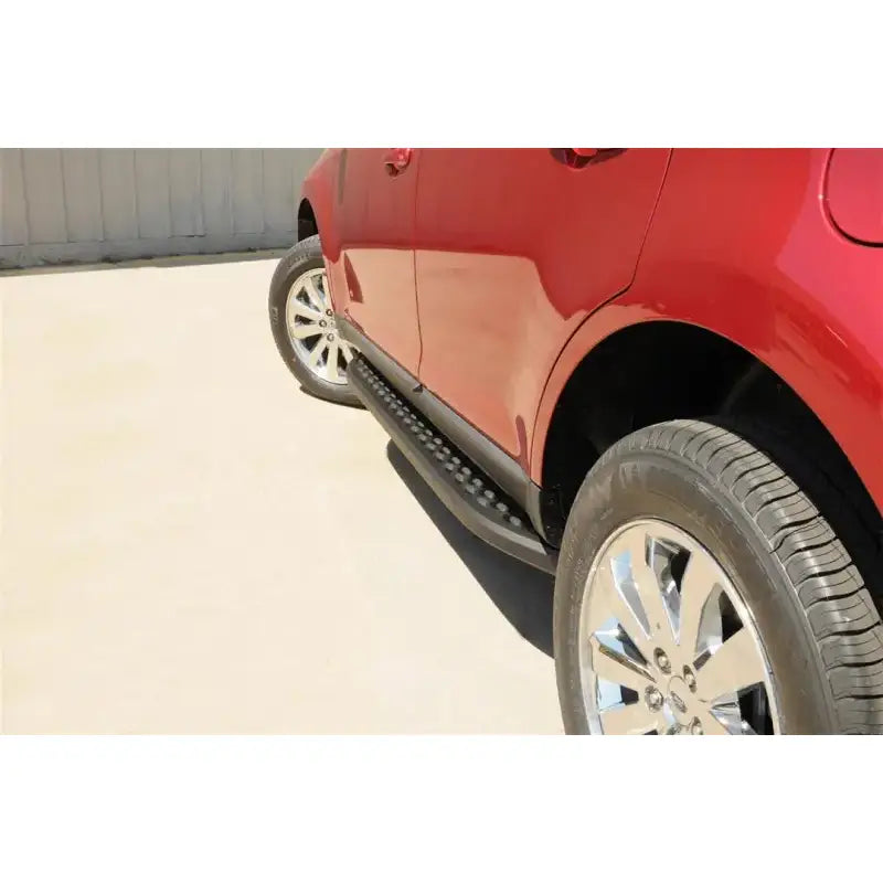 Red SUV with powder coated running board with black trim and stainless steel finish
