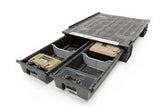 SB1 Decked Service Body with multiple open storage compartments, showcasing organized tools and parts for professionals using service vehicles. Robust, secure, and integrates seamlessly with Decked storage systems.