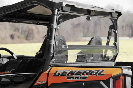 Orange and black utility vehicle with Seizmik Hard Rear Dust Panel UC Poly 4025