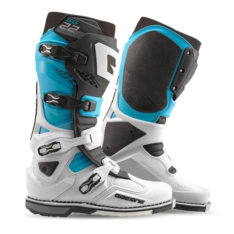 Two Gaerne SG-22 motocross boots in white and blue for guard dual riding gear