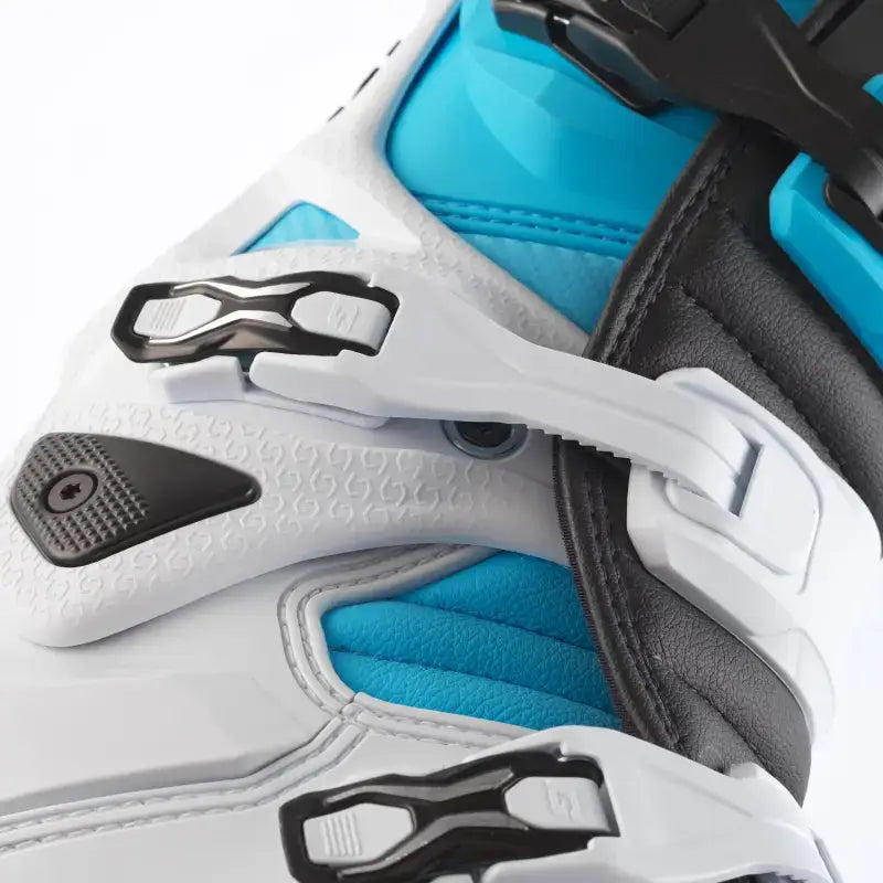 White and blue motocross boot with black accents and buckle closures for guard dual RV parts & accessories