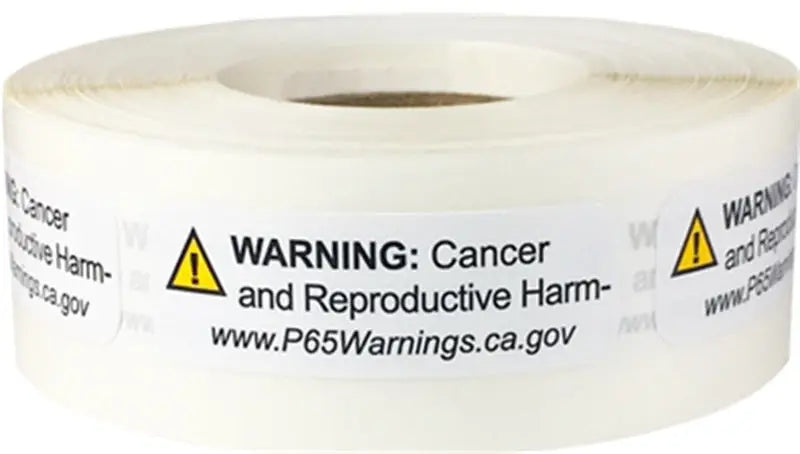 Roll of warning labels with "WARNING: Cancer and Reproductive Harm - www.P65Warnings.ca.gov" text for Skunk2 Racing products.