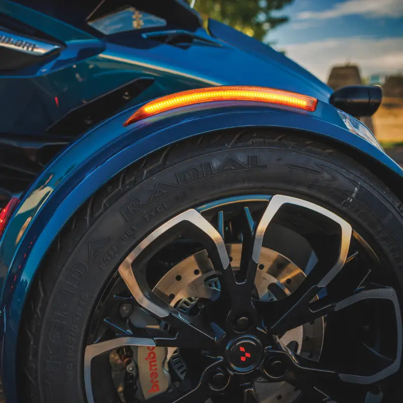 Blue three-wheeled motorcycle front wheel with Slayer Fender LED Light Amber Lens Can