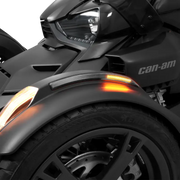 Black three-wheeled motorcycle with Slayer Fender LED Light Smoke Lens and orange turn signals