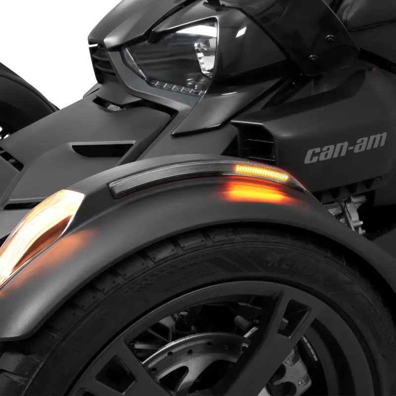 Black three-wheeled motorcycle with Slayer Fender LED Light Smoke Lens and orange turn signals