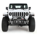Front view of a rugged white off-road vehicle featuring the Smittybilt Gear Tail Gate Cover in black, enhancing protection and style.
