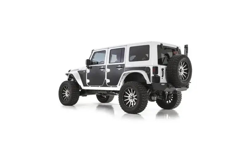 White off-road vehicle featuring Smittybilt Mag-Armor (Set Of 15), providing durable protection and sleek design.