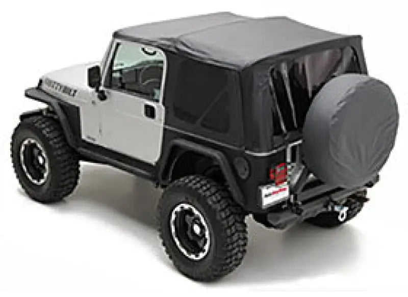 Gray soft-top Jeep Wrangler with Smittybilt Repl Top W Tint Blk Dia for style