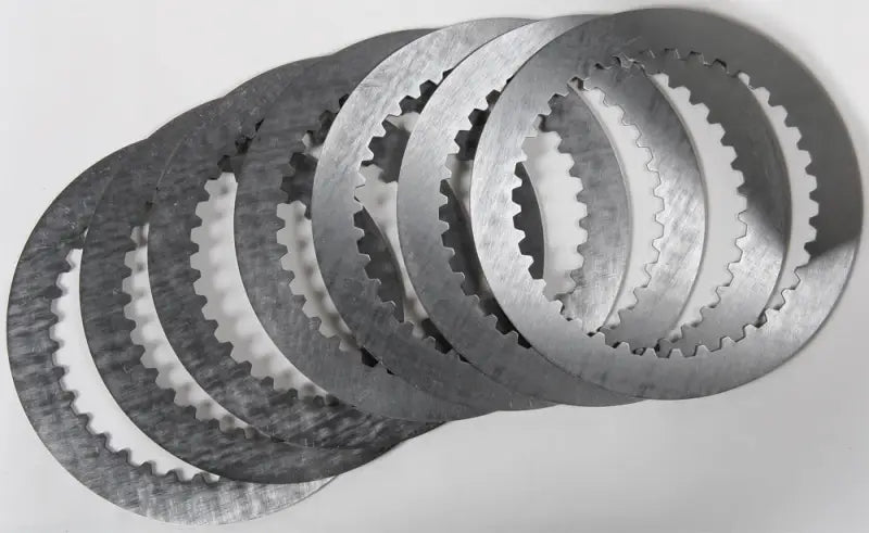 Stack of seven steel clutch plates with serrated edges for sp232-7-001 high production tolerances