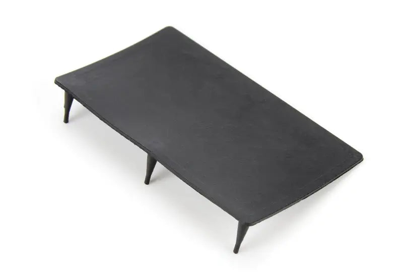 SPAL Fan accessory rubber flap on rectangular black table with tapered legs