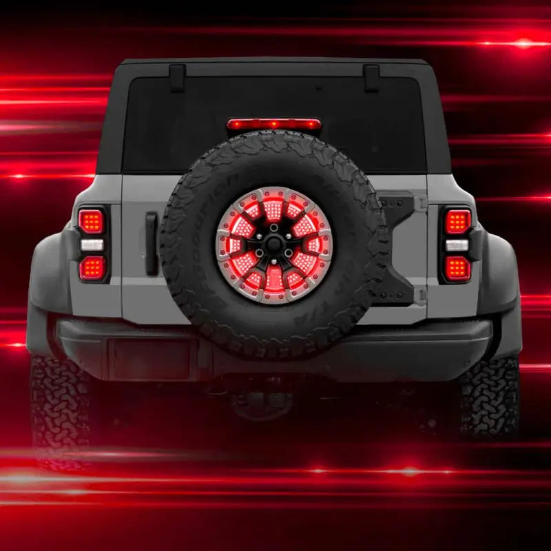 Spare tire with XKGLOW LED brake light, featuring smoke lens and red/white bulbs, mounted on a vehicle rear, showcasing integrated running, brake, reverse, and sequential turn signal functions.