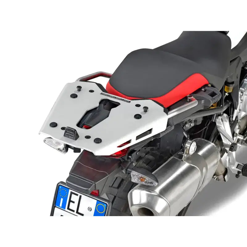 Silver motorcycle luggage rack with mounting hardware and black red seat for BMW