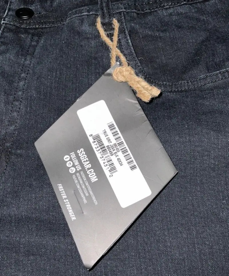 Dark denim jeans with attached tag from Speed and Strength True Grit denim collection