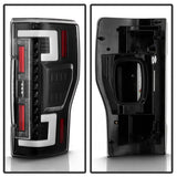 Black LED tail lights with white C-shaped bars and red accents for Ford F250 SD