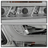 Close-up of chrome Chevy Tahoe projector headlights with LED DRL from Spyder Chevy Tahoe