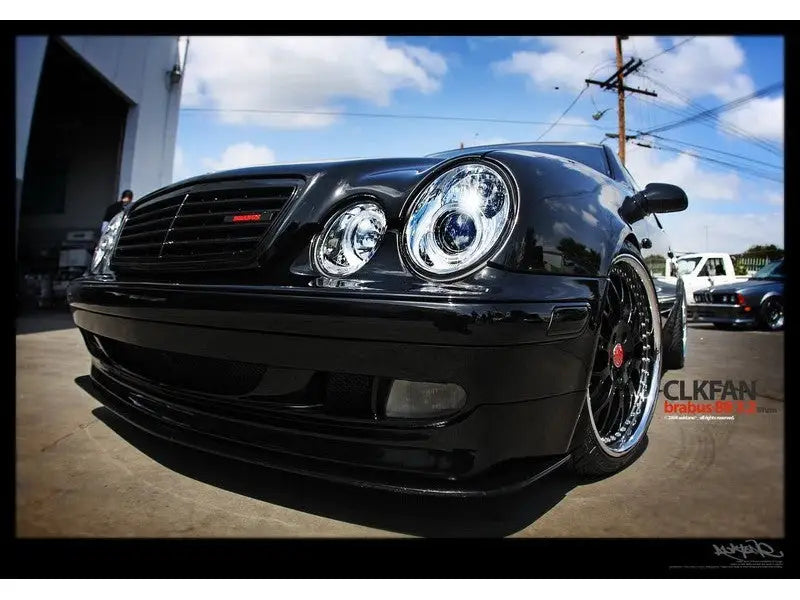 Black Mercedes Benz CLK with projector headlights and LED halo for sleek style