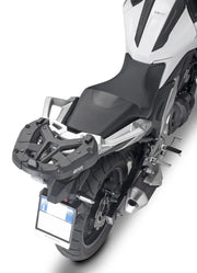 Motorcycle with matte black hard luggage mounting hardware and rear luggage rack