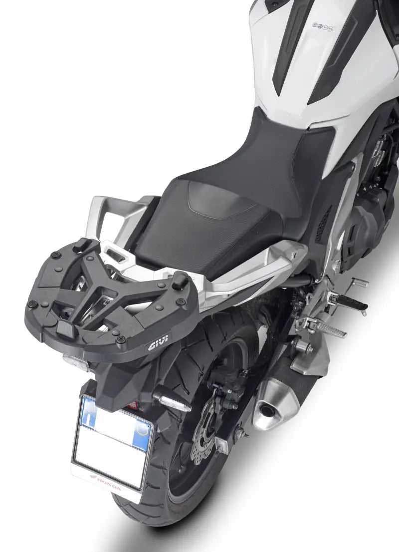 Motorcycle with matte black hard luggage mounting hardware and rear luggage rack