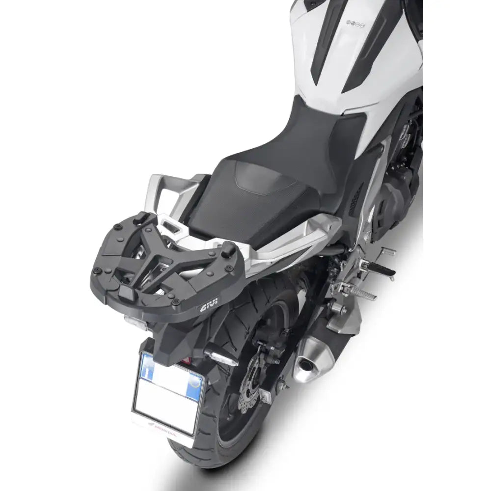 Motorcycle with matte black hard luggage mounting hardware and rear luggage rack