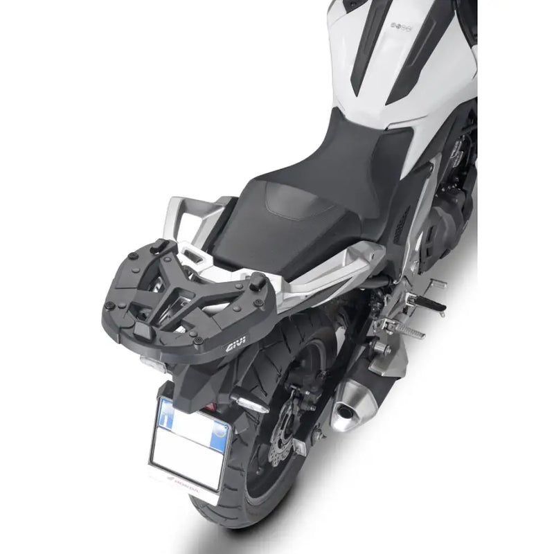 Motorcycle with matte black hard luggage mounting hardware and rear luggage rack