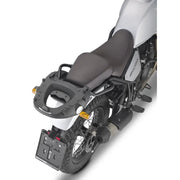 Rear view of white motorcycle with matte black luggage mounting hardware and grab handles