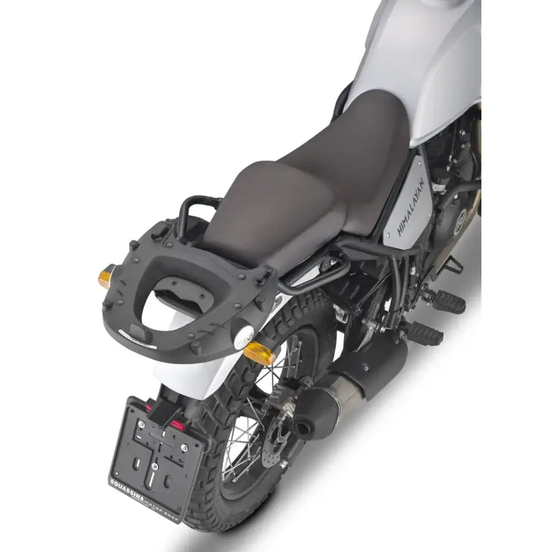 Rear view of white motorcycle with matte black luggage mounting hardware and grab handles
