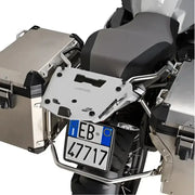 Rear view of motorcycle with matte black hard luggage mounting hardware and side cases