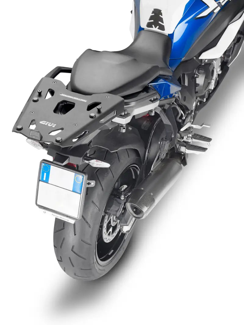 Black motorcycle with rear rack and exhaust, SRA5138B hard luggage mounting hardware