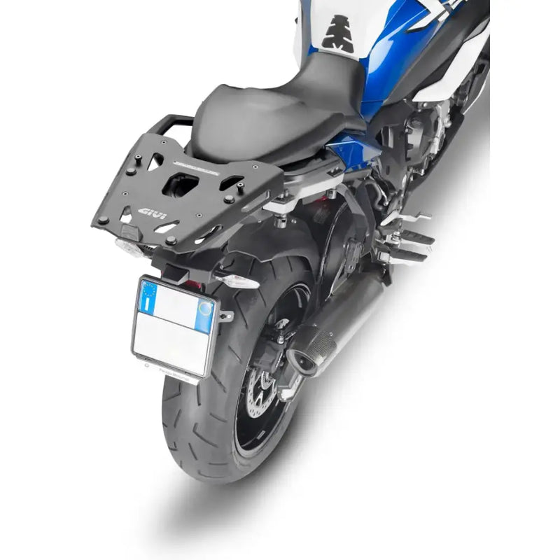 Black motorcycle with rear rack and exhaust, SRA5138B hard luggage mounting hardware