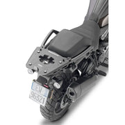 Motorcycle with matte black hard luggage mounting hardware and rear exhaust pipe