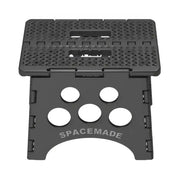 SS-9 Big Ant Folding Step Stool 9In by Spacemade, compact design, black, sturdy construction, non-slip surface, foldable for easy storage, supports up to 300 pounds.