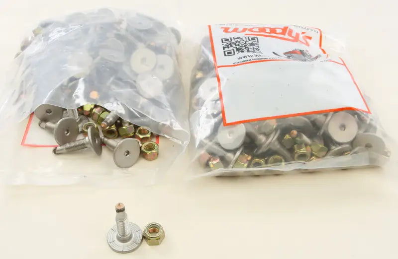 Two bags of SSP-1075-C Signature Series Trail Studs and Nuts with a single stud and nut displayed